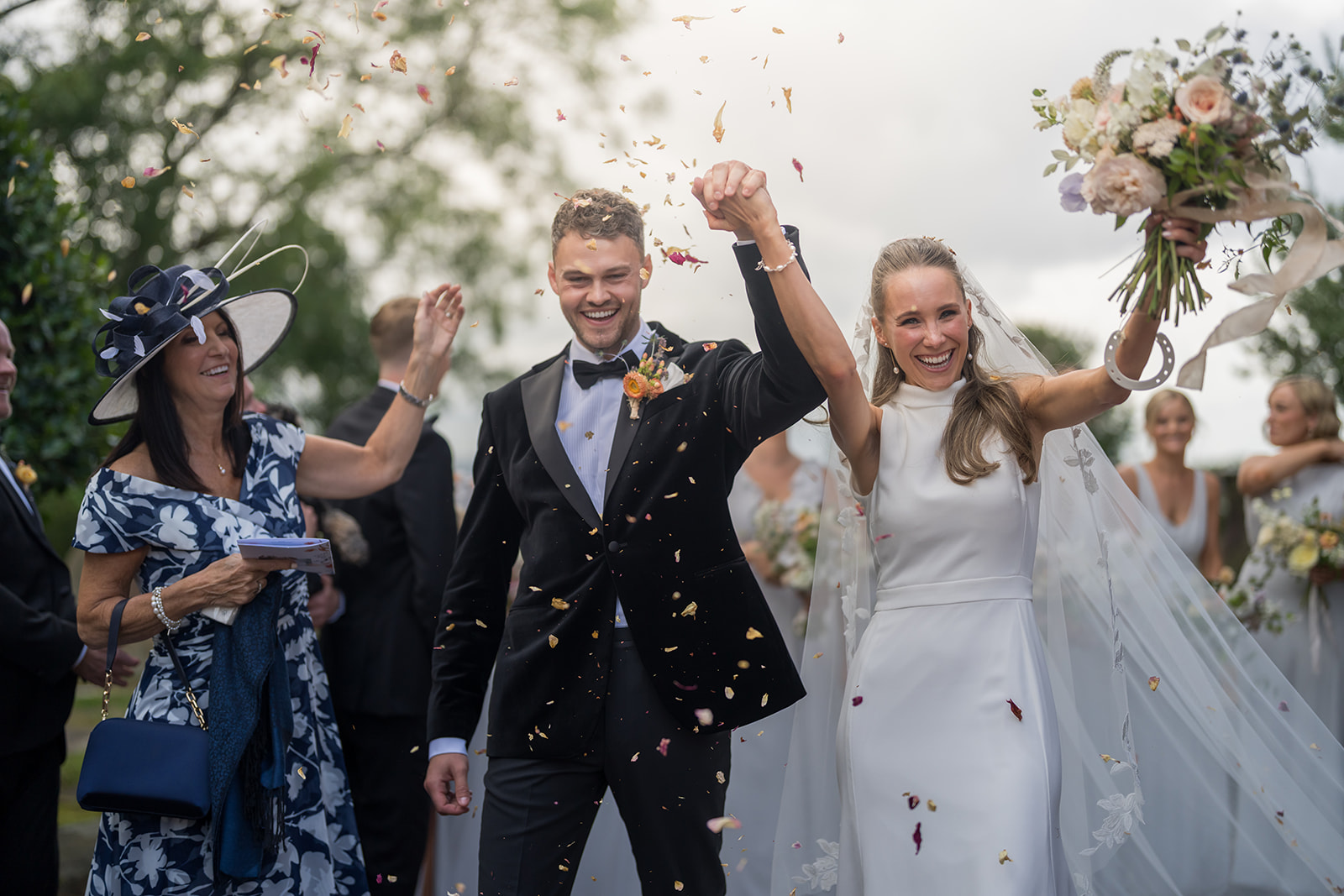 Newlyweds celebrating beneath a shower of confetti
