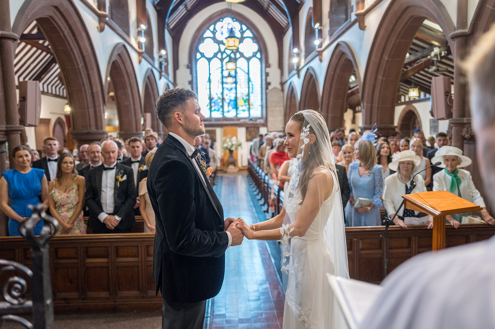 Bride and groom exchanging vows during a church ceremony