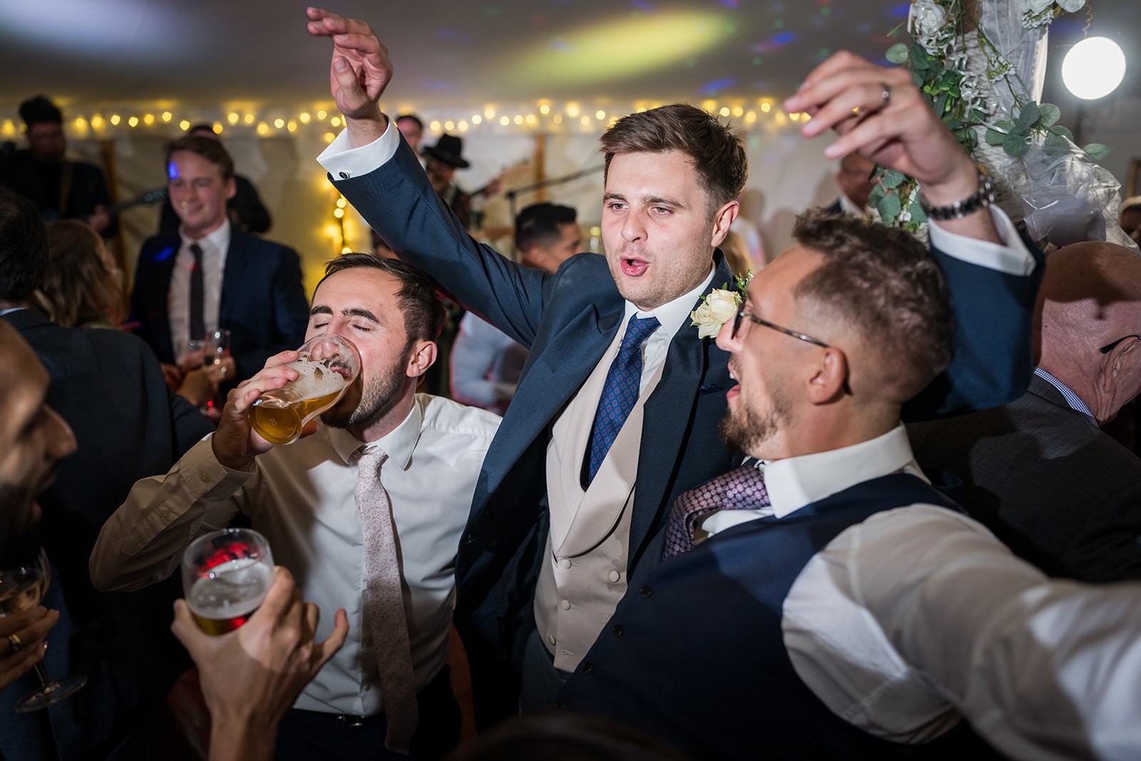 Guests celebrating together on a crowded dance floor