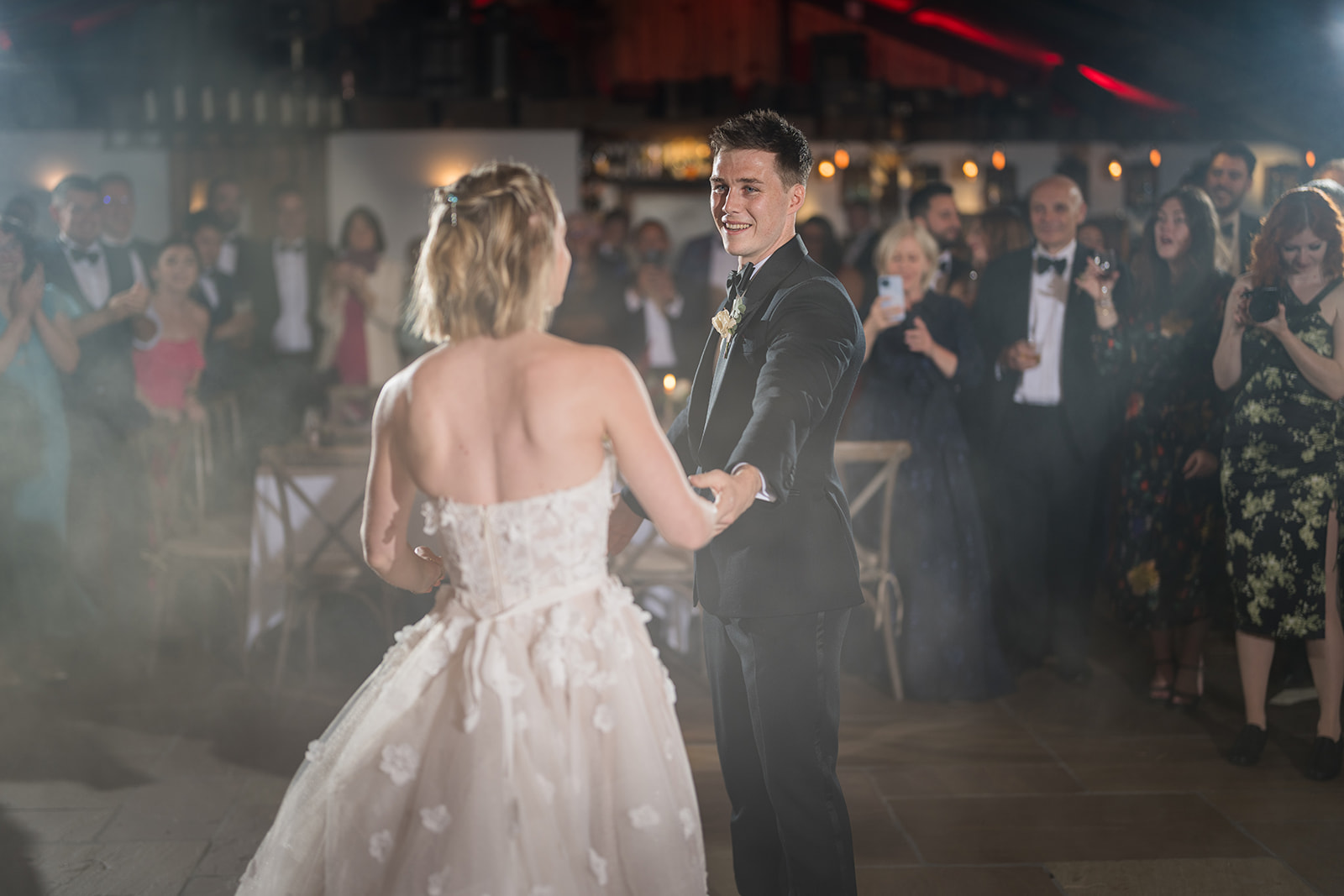 Bride and groom dancing together at their evening reception