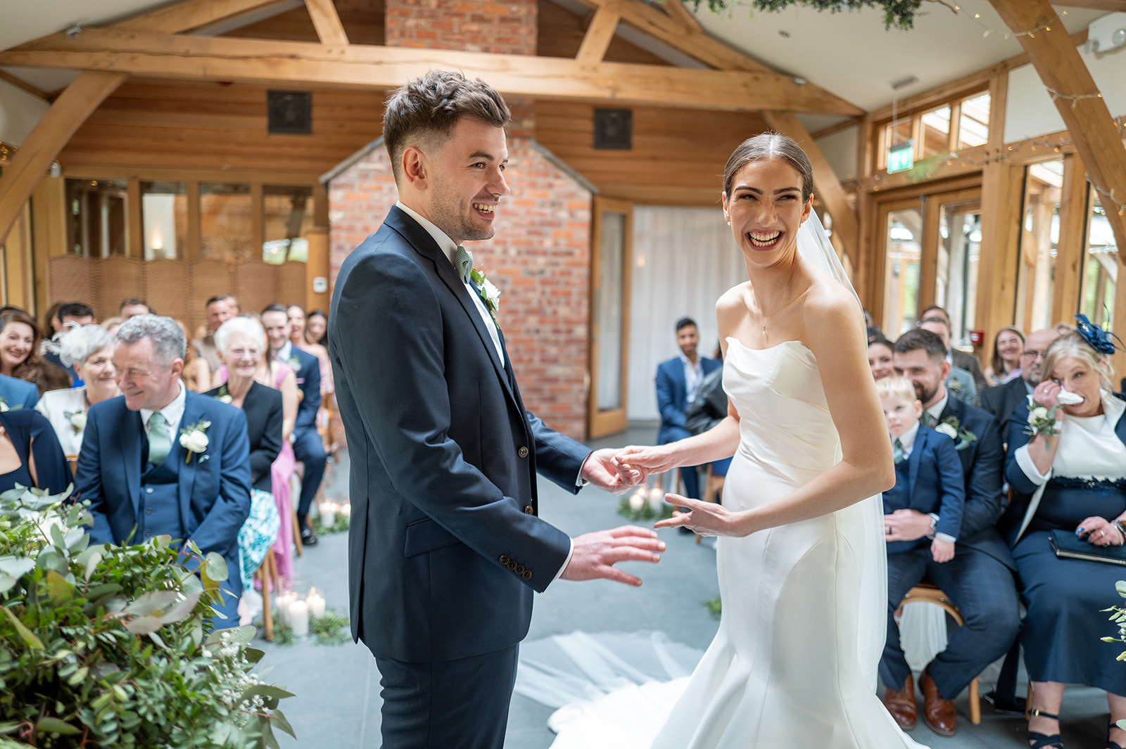 Bride and groom having outdoor portraits at Rylands Farmhouse wedding venue in Cheshire