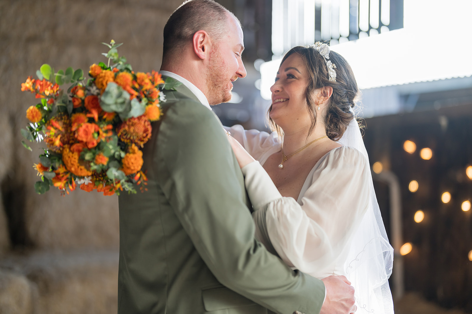 Bride and groom having outdoor portraits at Rylands Farmhouse wedding venue in Cheshire