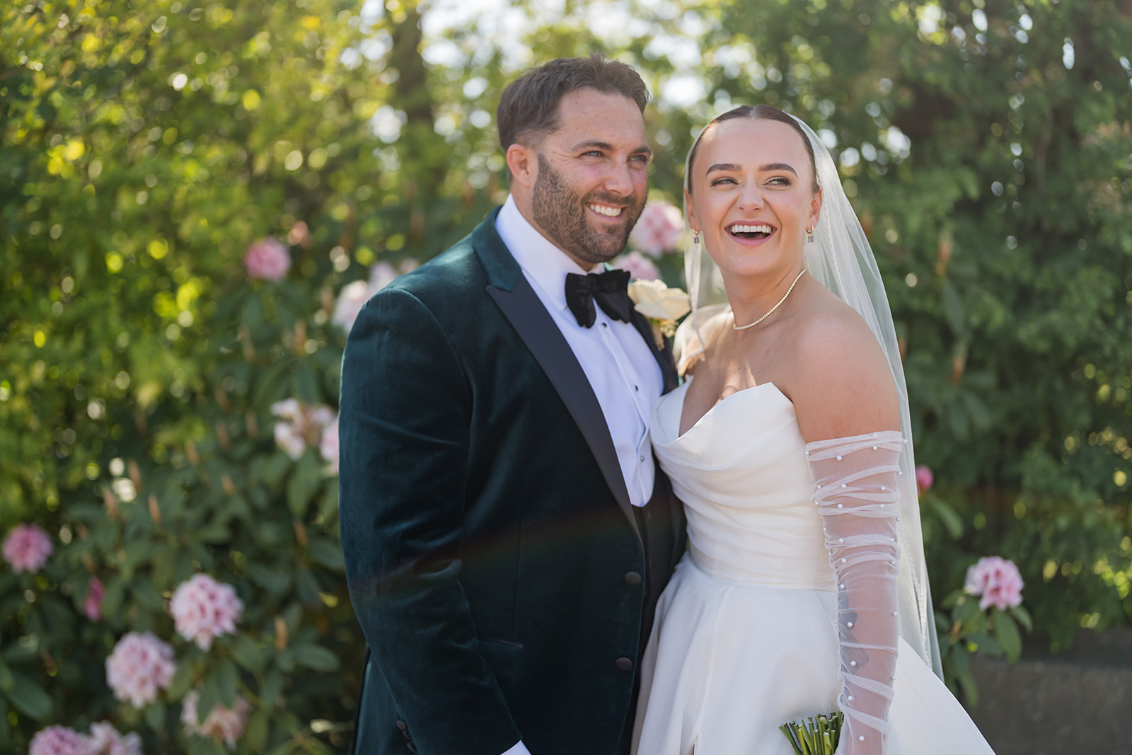 Bride and groom having outdoor portraits at Rylands Farmhouse wedding venue in Cheshire